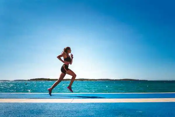 Woman running showing strong leg muscle Dorchester